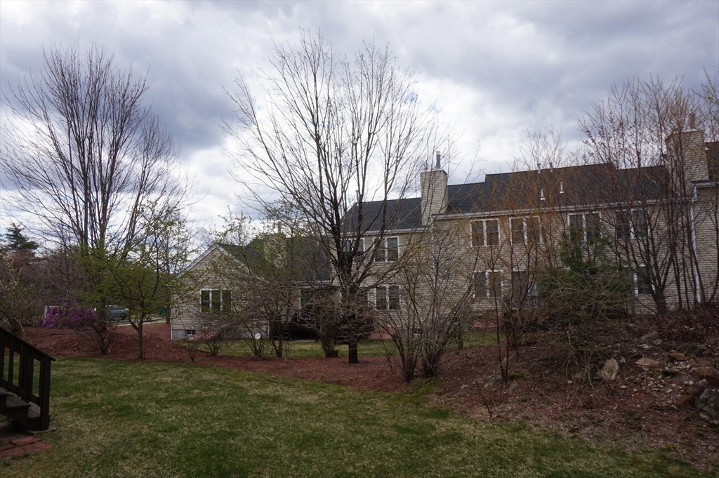 103 Bridle Cross Road, Unit 103 Fitchburg, MA 01420 - Photo 36 of 36 a view of backyard with trees