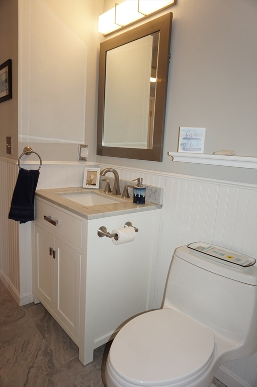 103 Bridle Cross Road, Unit 103 Fitchburg, MA 01420 - Photo 5 of 36 a bathroom with a toilet sink and mirror