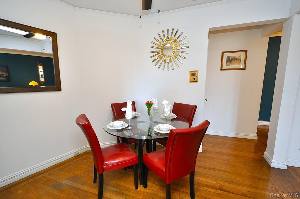 949 Palmer Road, Unit 2G Bronxville, NY 10708 - Photo 13 of 40 a dining room with furniture and wooden floor