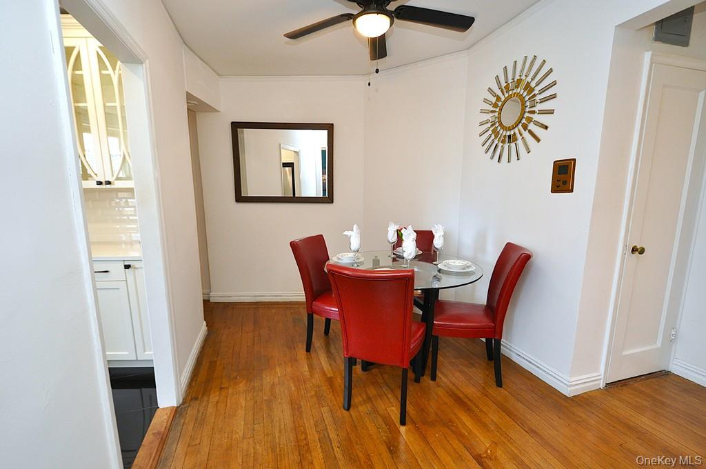 949 Palmer Road, Unit 2G Bronxville, NY 10708 - Photo 14 of 40 a view of a dining room with furniture and wooden floor