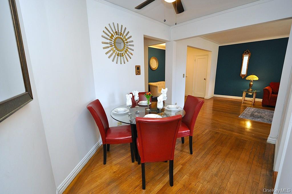 949 Palmer Road, Unit 2G Bronxville, NY 10708 - Photo 15 of 40 a view of a dining room with furniture and wooden floor