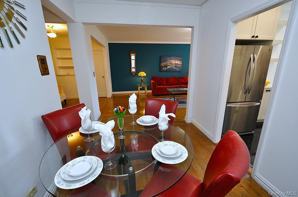 949 Palmer Road, Unit 2G Bronxville, NY 10708 - Photo 16 of 40 a dining room with furniture and wooden floor