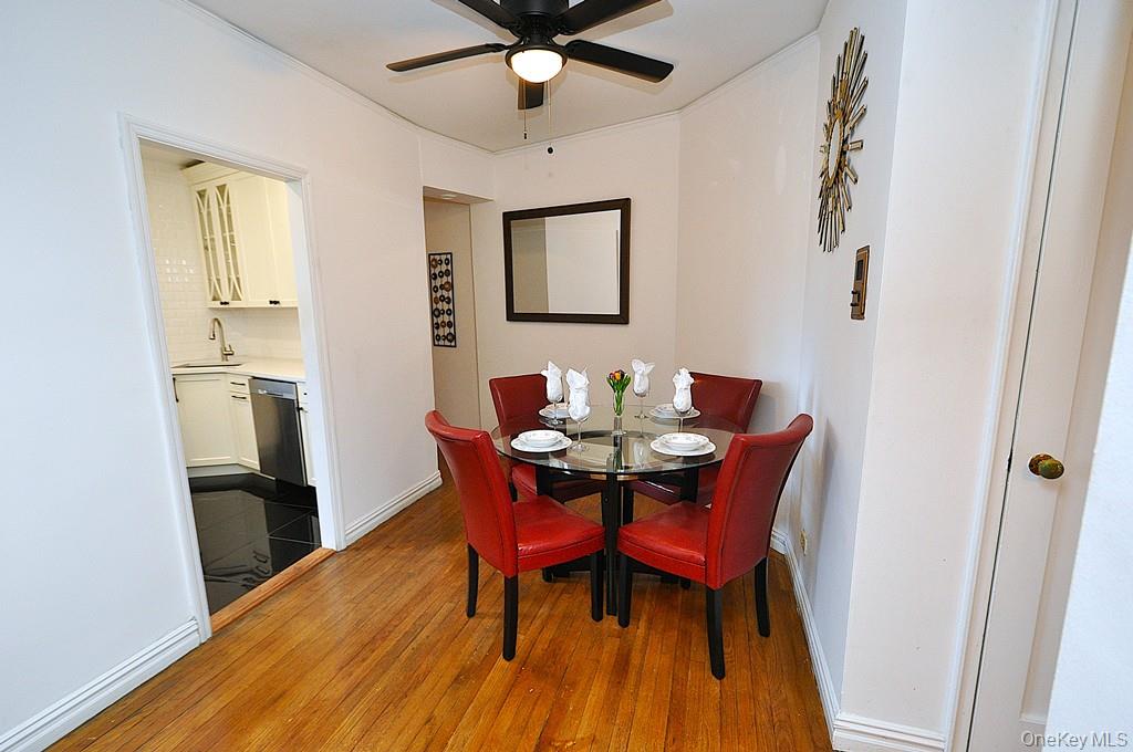 949 Palmer Road, Unit 2G Bronxville, NY 10708 - Photo 17 of 40 a view of a dining room with furniture and wooden floor