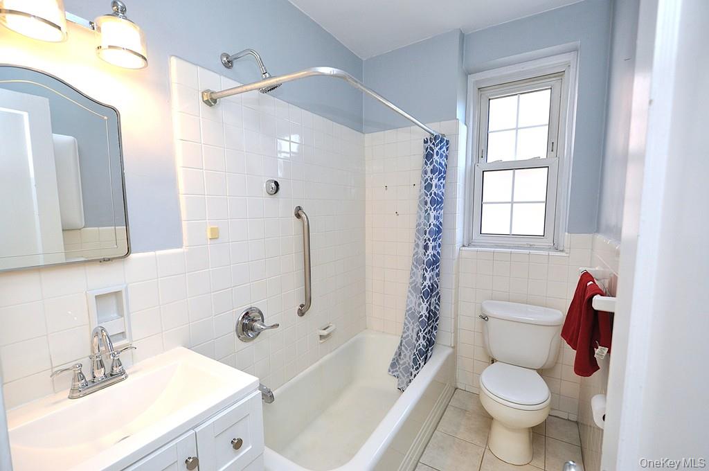 949 Palmer Road, Unit 2G Bronxville, NY 10708 - Photo 22 of 40 a bathroom with a sink toilet and shower