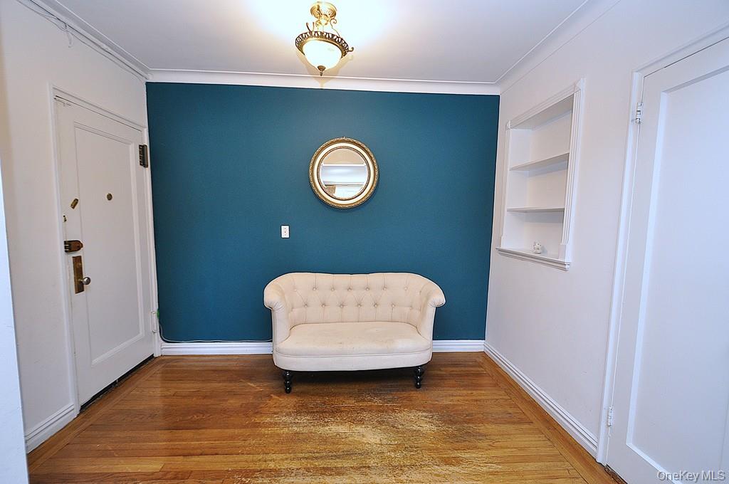 949 Palmer Road, Unit 2G Bronxville, NY 10708 - Photo 24 of 40 a view of an empty room with wooden floor and window