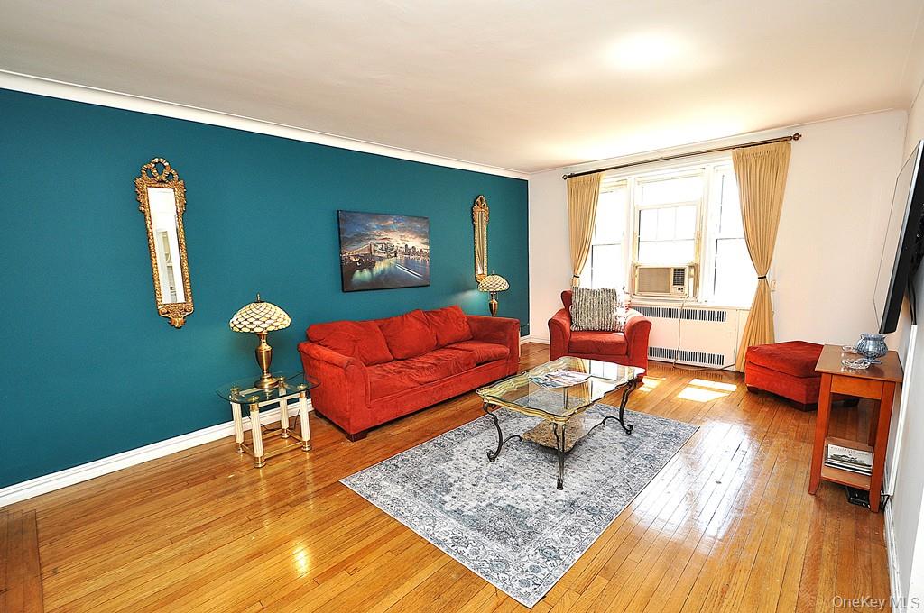 949 Palmer Road, Unit 2G Bronxville, NY 10708 - Photo 3 of 40 a living room with furniture and a flat screen tv
