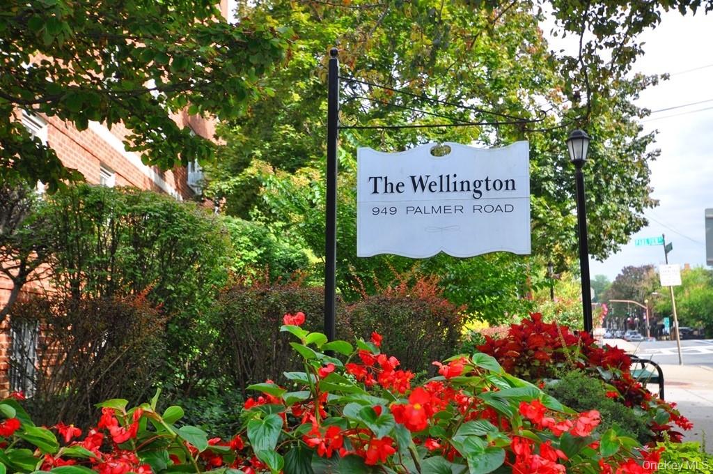 949 Palmer Road, Unit 2G Bronxville, NY 10708 - Photo 31 of 40 a sign that is in front of flowers