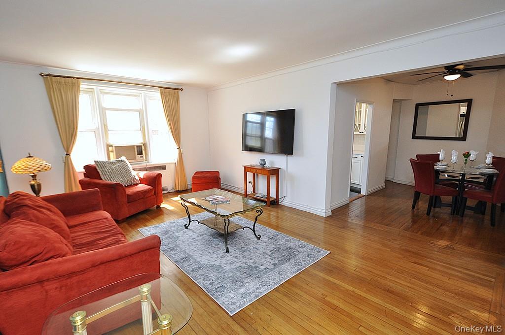 949 Palmer Road, Unit 2G Bronxville, NY 10708 - Photo 4 of 40 a living room with furniture and a flat screen tv