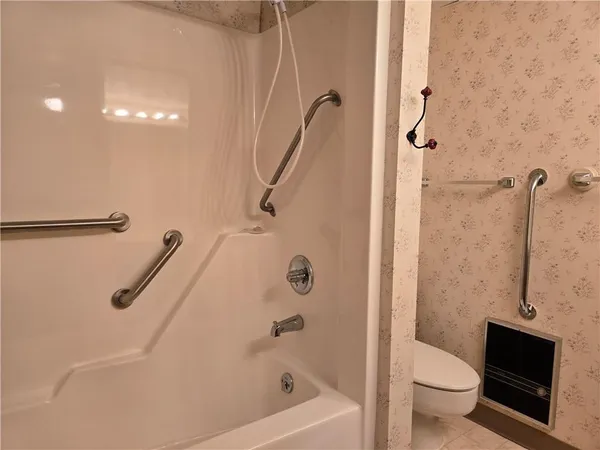 a view of a brick house with a large door