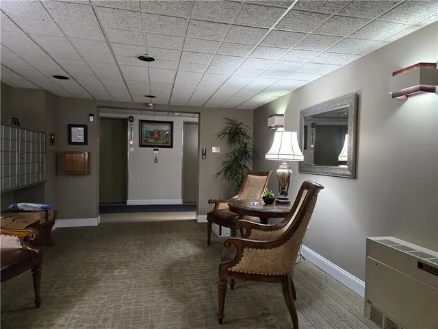 a dining room with a table and chairs