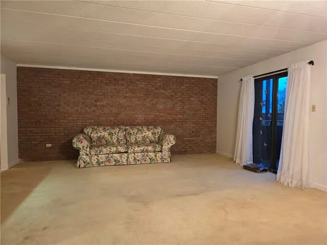 a view of a chandelier and a chandelier fan in a room