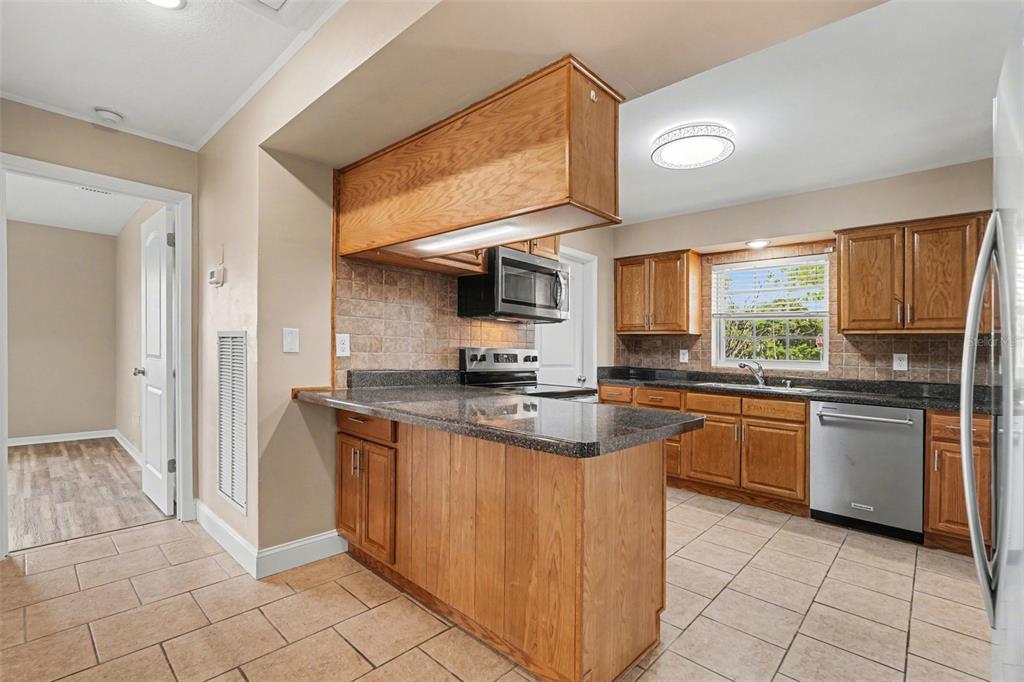 1338 Pilgrim Road Spring Hill, FL 34606 - Photo 7 of 26 Gallery Image 7