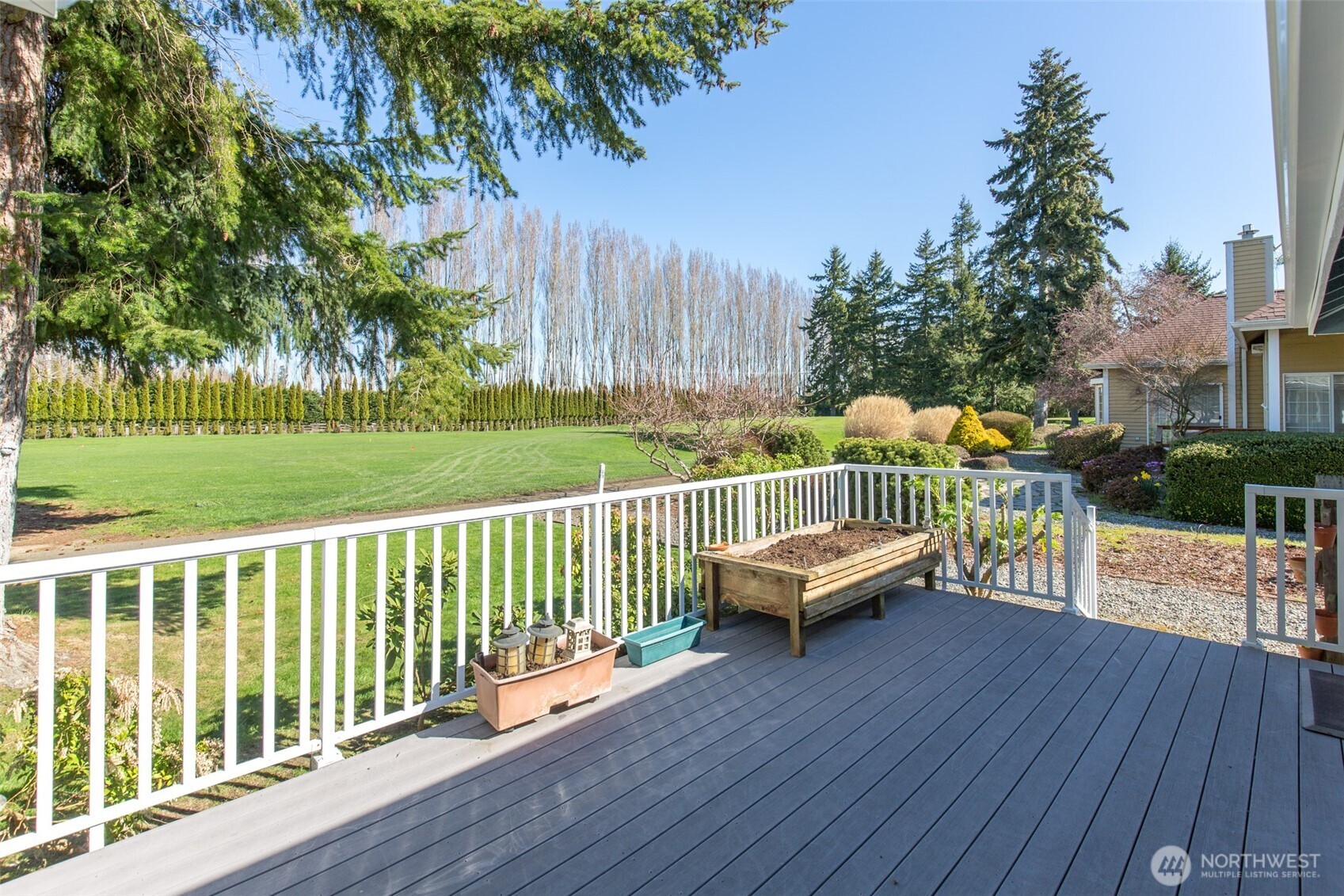 170 Hurricane Ridge Drive Sequim, WA 98382 - Photo 9 of 39 a view of a wooden deck with furniture and garden