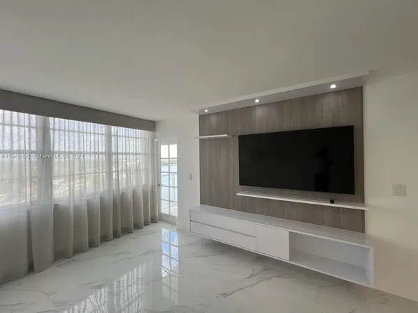 a bathroom with a double vanity sink toilet mirror and bathtub