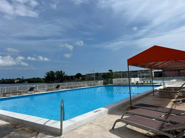 a view of a swimming pool with lounge chair