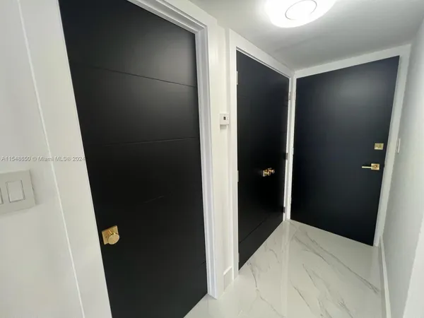 a kitchen with refrigerator a microwave and cabinets