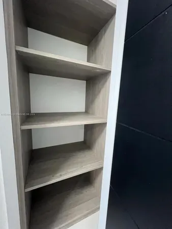 a kitchen with a sink and refrigerator