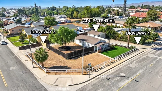 a view of a swimming pool with a patio and a garden