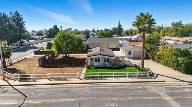 an aerial view of a house with outdoor space