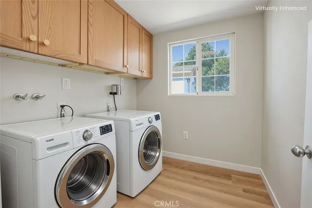 a bedroom with a large bed and a potted plant