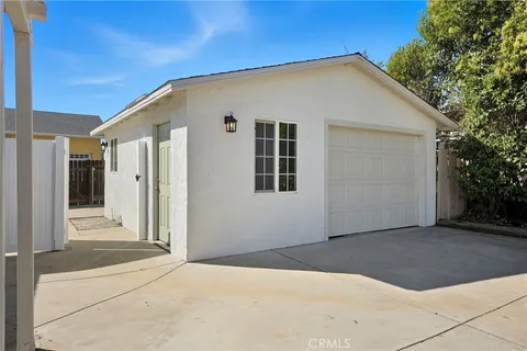 a view of a patio with couches and potted plants