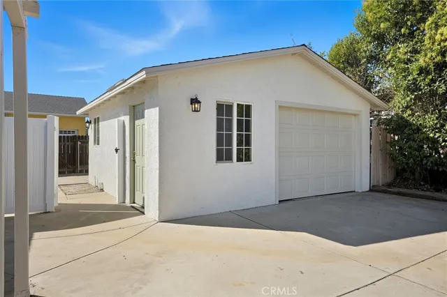 a view of a patio with couches and potted plants