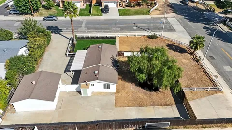 aerial view of a house with a yard