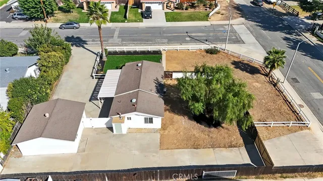 aerial view of a house with a yard