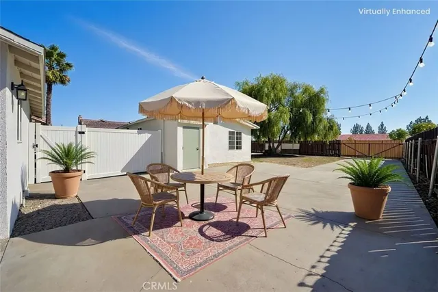 an aerial view of a house with a yard and lake view