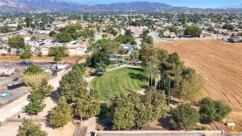 an aerial view of residential houses and outdoor space