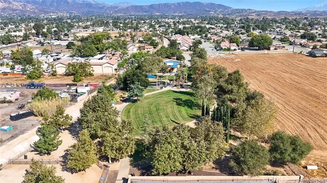 an aerial view of residential houses and outdoor space