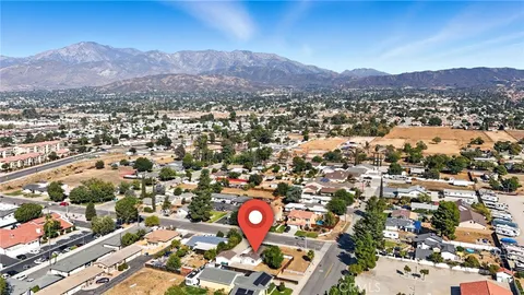 a house that has a tree in front of it