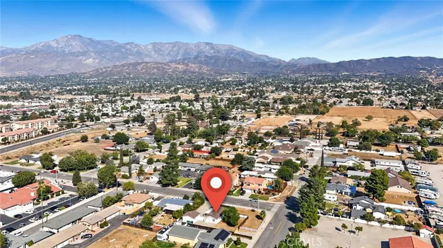 a house that has a tree in front of it