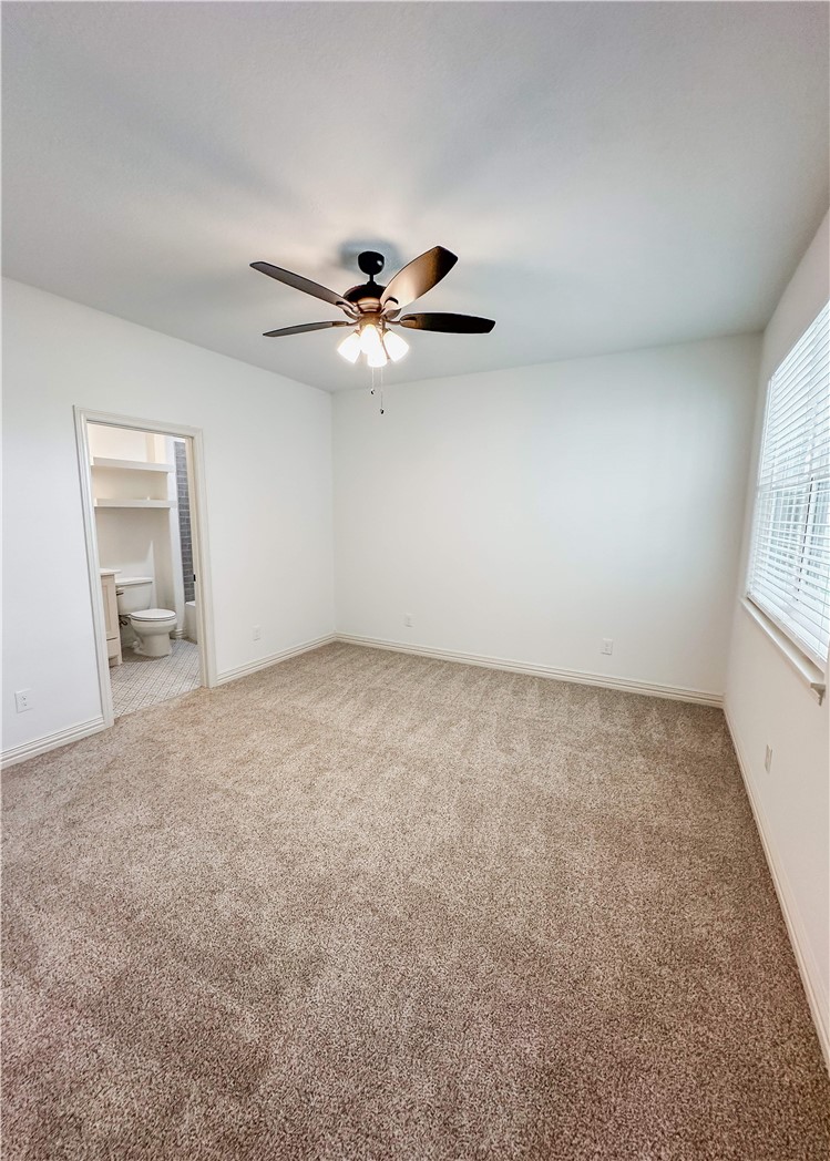 3201 Hunters Crossing Bryan, TX 77808 - Photo 18 of 40 Unfurnished bedroom featuring light colored carpet and ceiling fan