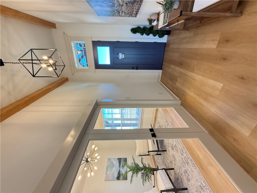 3201 Hunters Crossing Bryan, TX 77808 - Photo 29 of 40 Entryway with hanging lights and light wood-style floors