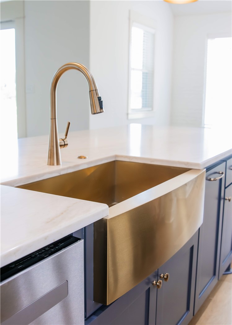 3201 Hunters Crossing Bryan, TX 77808 - Photo 9 of 40 Kitchen view of blue cabinetry, dishwasher, and light stone counters