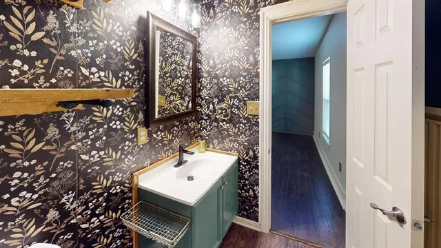 a bathroom with a sink and mirror