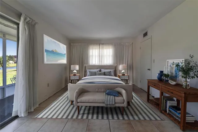 a living room with furniture a window and a table