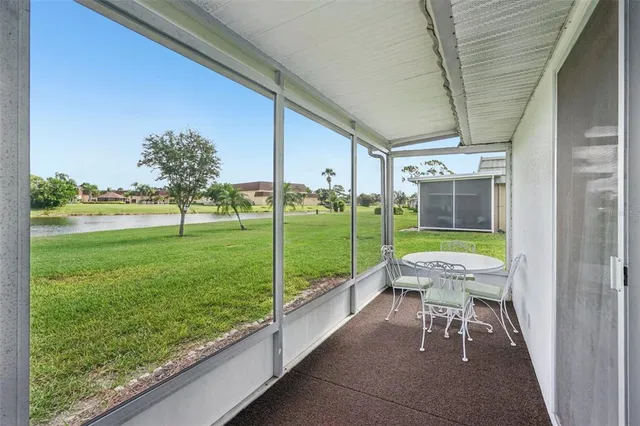 a view of a porch with furniture and yard