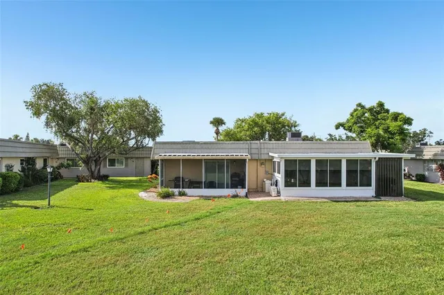 a front view of a house with a garden and porch