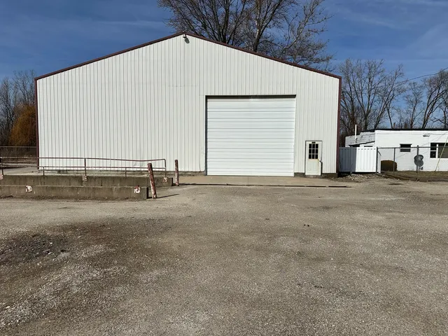 a view of a house with a back yard