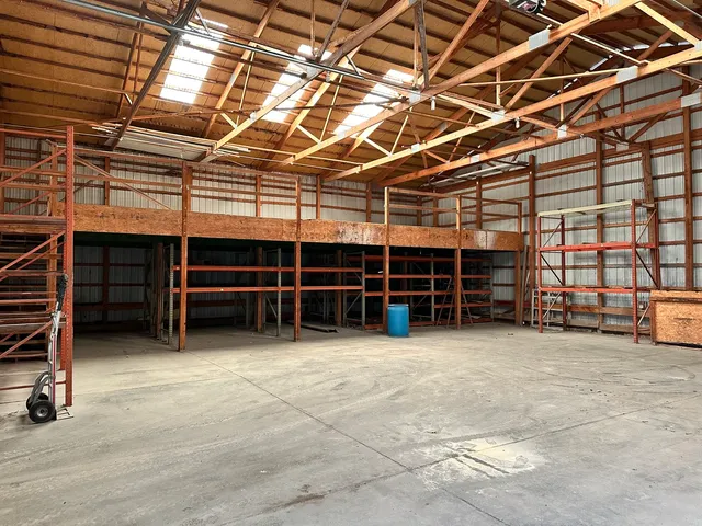 a view of a room with furniture and racks