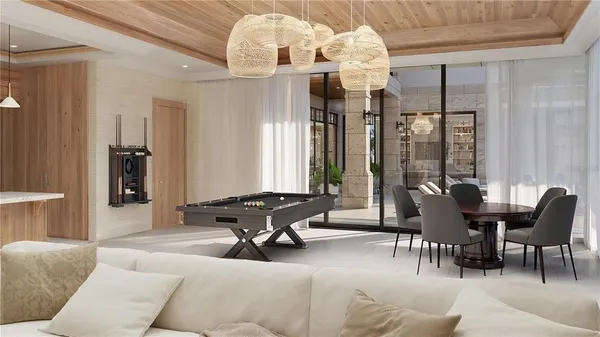 a living room with furniture and chandelier