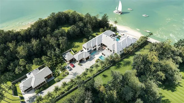 an aerial view of a house with a yard and garden