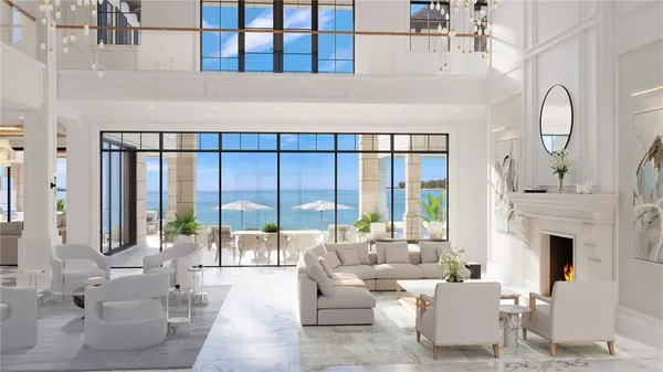 a living room with furniture large window and a fireplace