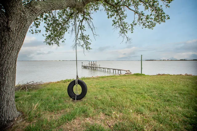 a view of a lake with a big yard