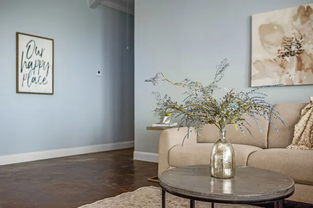 a dining room with furniture and wooden floor