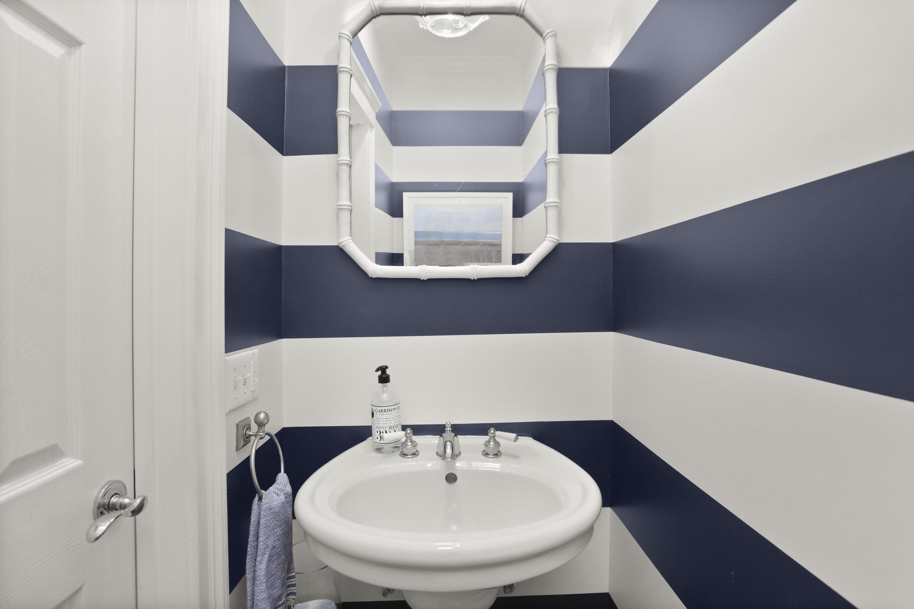 27 A Middlesex Road Darien, CT 06820 - Photo 9 of 27 a bathroom with a sink and a mirror