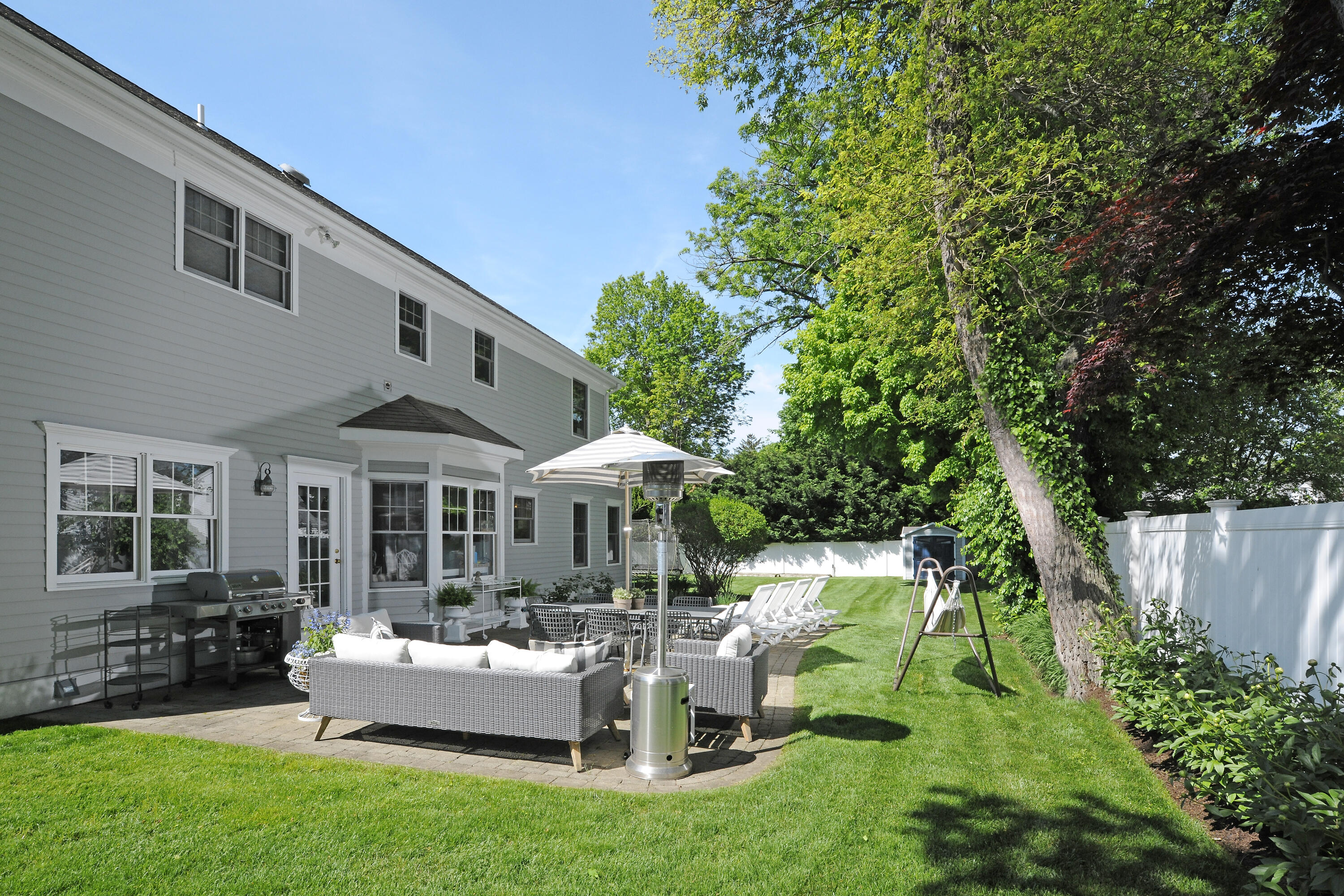 27 A Middlesex Road Darien, CT 06820 - Photo 10 of 27 a view of a house with backyard sitting area and garden