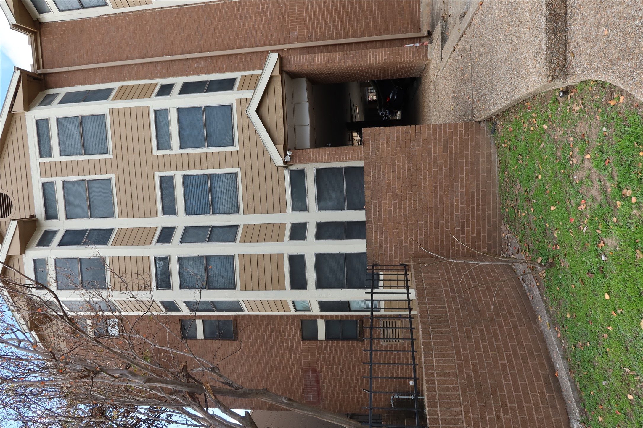 2802 Nueces Street, Unit 306 Austin, TX 78705 - Photo 2 of 17 a front view of a house with a yard